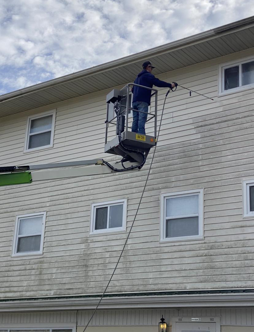 Pressure washing the siding of a multi-family building